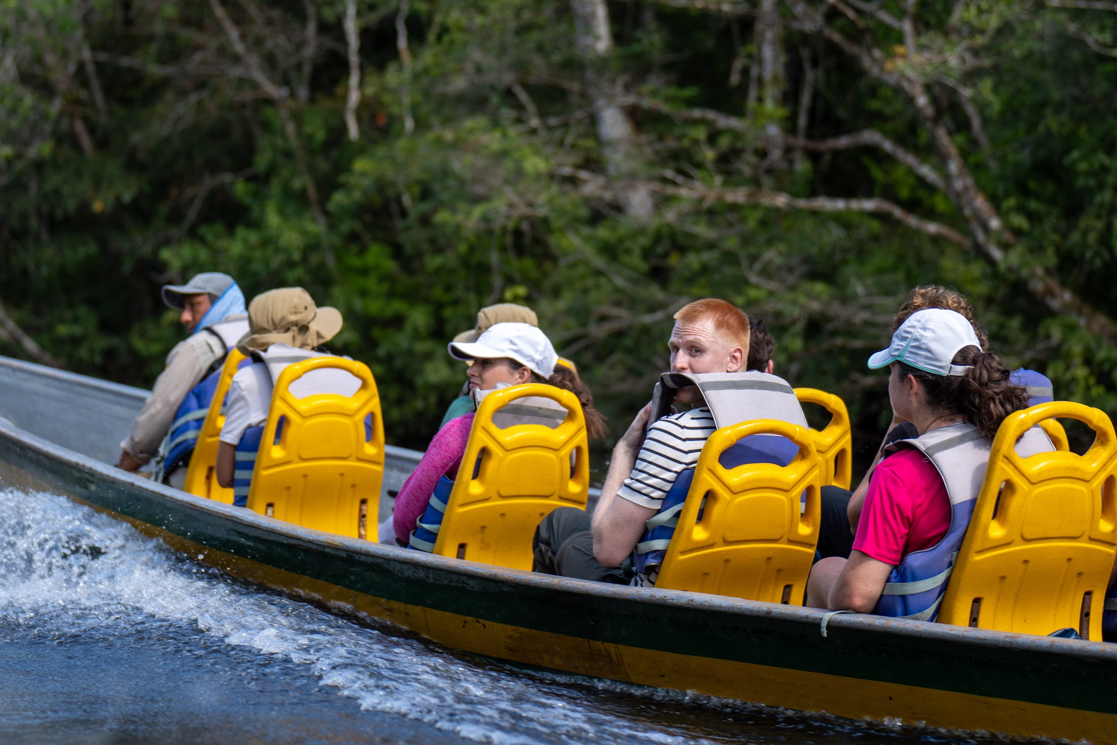 Travelers on a canoe safari through the flooded forest of Cuyabeno, in the Amazon &mdash; one of the New 7 Wonders of Nature