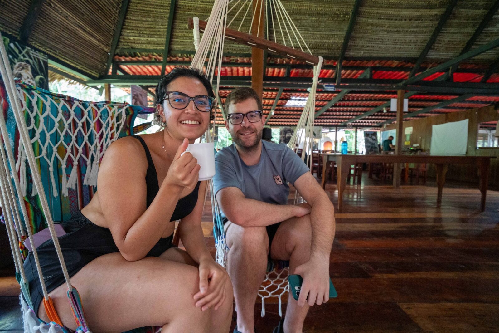 Guests relaxing in the hammock area of Cuyabeno Dolphin Lodge