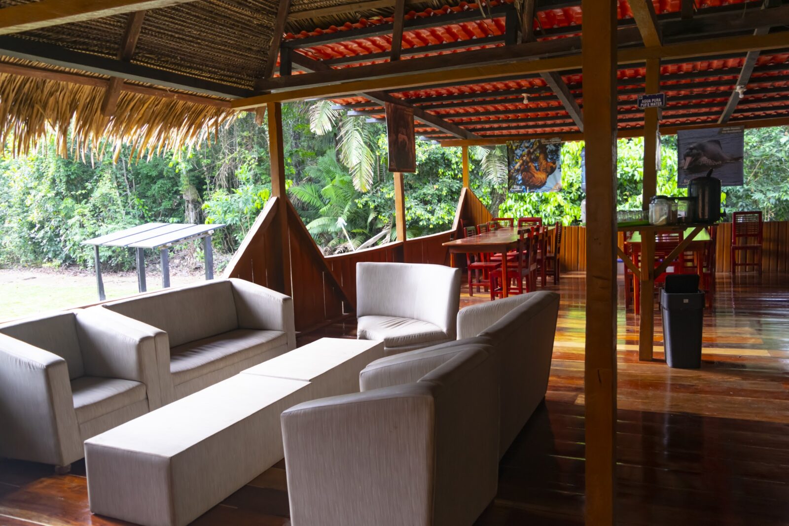 Lounge with sofas at the main house of Cuyabeno Dolphin Lodge