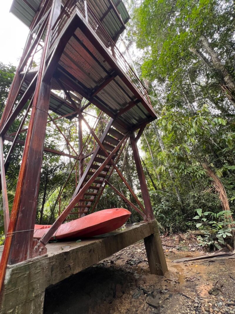 Base of the observation tower at Cuyabeno Dolphin Lodge, next to the kayaks