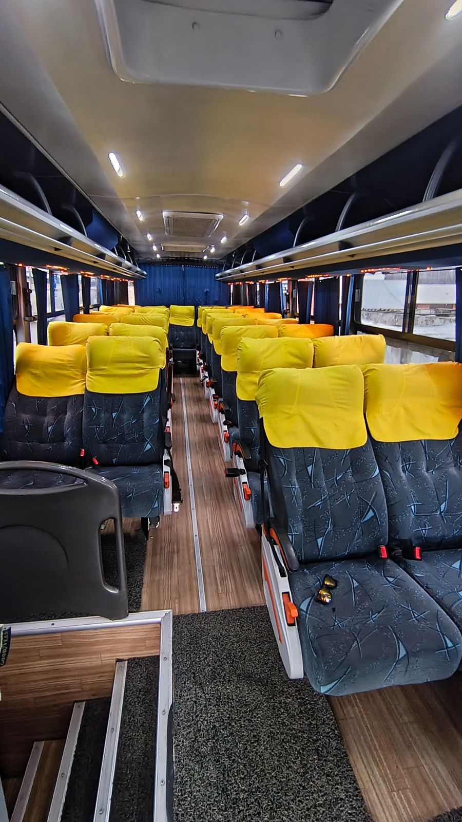 Interior of the tourist shuttle to Cuyabeno with reclining seats