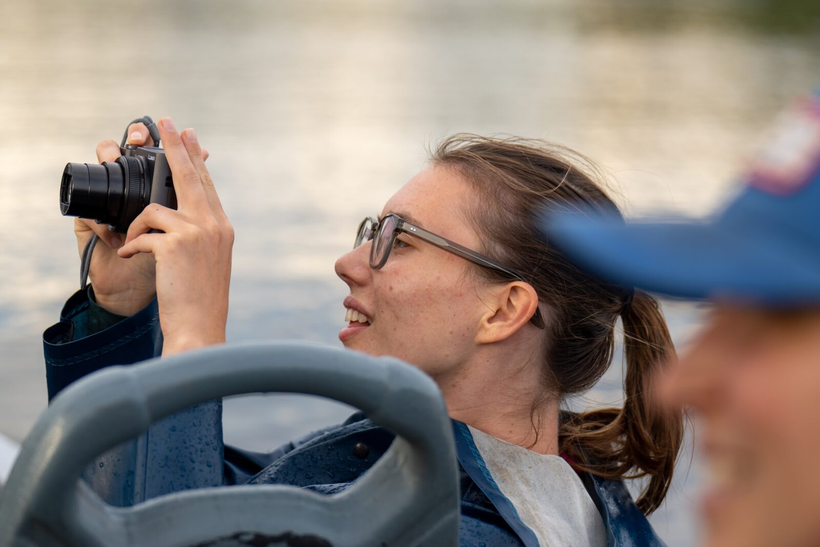 Traveler photographing wildlife from the canoe in Cuyabeno
